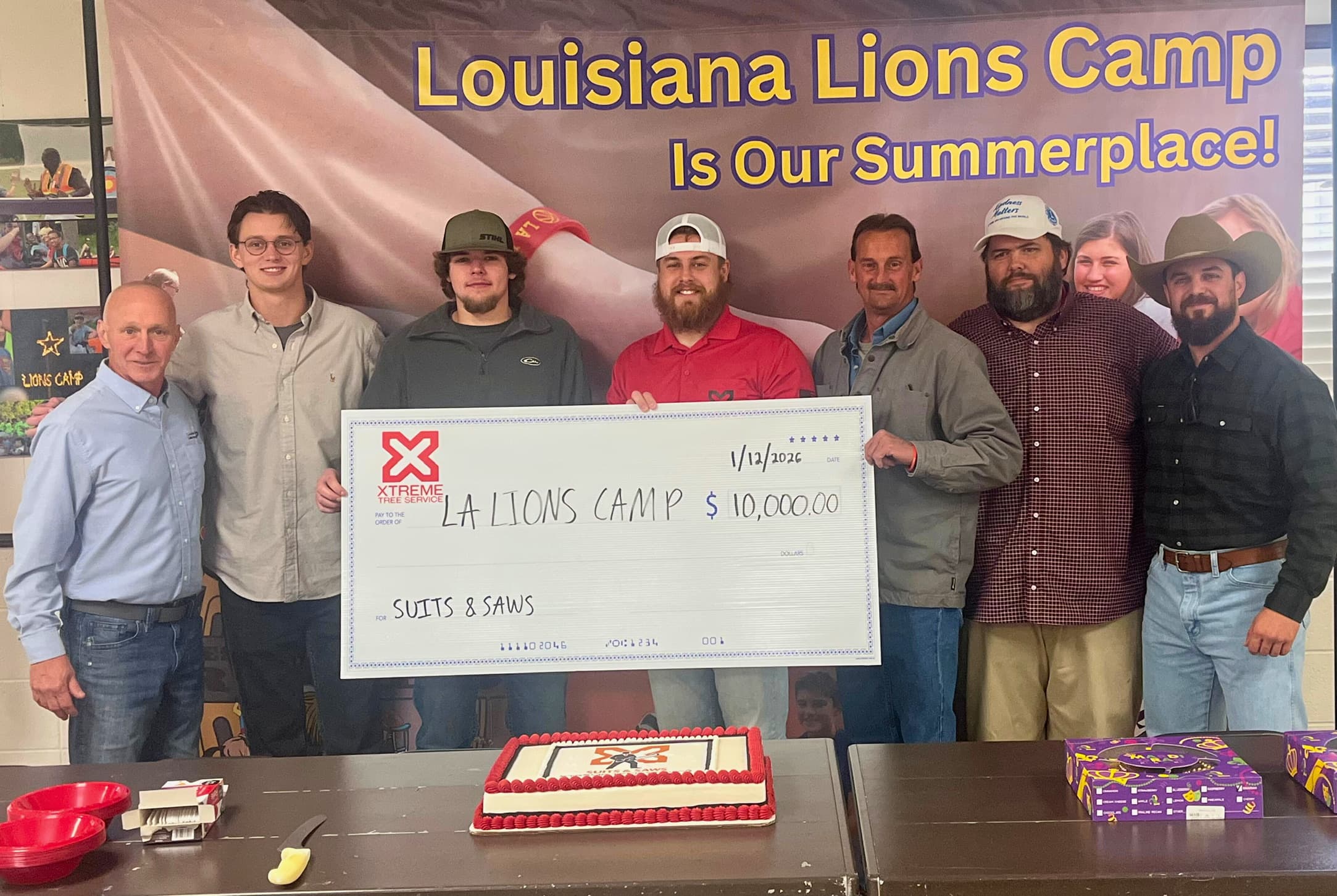 XTREME Tree Service team presenting ceremonial $10,000 check to Louisiana Lions Camp for Disabled Children